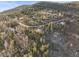Distant aerial view shows the landscape and the proximity of other residences at 9790 City View Dr, Morrison, CO 80465