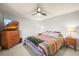 Well-lit bedroom features colorful blankets, side tables with lamps, and modern decor at 9790 City View Dr, Morrison, CO 80465