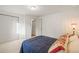 Bedroom with carpet floor, closet, and wood door at 9790 City View Dr, Morrison, CO 80465