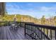 Elevated view of a wooden deck with seating and panoramic views of the surrounding landscape at 9790 City View Dr, Morrison, CO 80465