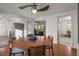 Dining room with hardwood floors, modern ceiling fan, round table with four chairs, and natural light at 9790 City View Dr, Morrison, CO 80465