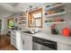 Updated kitchen featuring white cabinets, stainless steel appliances, quartz countertop, and modern fixtures at 9790 City View Dr, Morrison, CO 80465