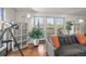 Bright living room showcases stylish decor and large windows offering views of the outdoor scenery, creating a serene atmosphere at 9790 City View Dr, Morrison, CO 80465