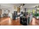 Spacious living room featuring hardwood floors, a charming fireplace, and abundant natural light, creating a warm and inviting ambiance at 9790 City View Dr, Morrison, CO 80465