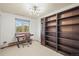 Office features a desk, chair, large window, and built-in bookshelves, perfect for work at 9790 City View Dr, Morrison, CO 80465