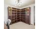 Office features built-in bookshelves with glass doors and ample storage space at 9790 City View Dr, Morrison, CO 80465