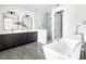 Modern bathroom with double vanity, soaking tub, and walk-in shower at 965 S Downing St, Denver, CO 80209