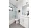 Clean bathroom with a glass shower and white vanity at 965 S Downing St, Denver, CO 80209