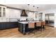 Open concept kitchen with stainless steel appliances and a large island at 965 S Downing St, Denver, CO 80209