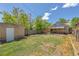 Expansive backyard featuring a detached garage and well-maintained lawn perfect for outdoor activities at 2140 S Washington St, Denver, CO 80210