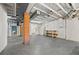 Unfinished basement with exposed ceiling, brick columns, and open space at 2140 S Washington St, Denver, CO 80210