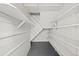 Basement storage area with white painted shelves and access to the home's interior at 2140 S Washington St, Denver, CO 80210