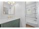 Stylish bathroom features a tiled shower and modern vanity with new fixtures at 2140 S Washington St, Denver, CO 80210