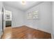 Hardwood bedroom with ensuite bathroom with a modern vanity and new fixtures at 2140 S Washington St, Denver, CO 80210