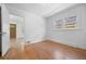 Bedroom with hardwood floors and natural light from double windows at 2140 S Washington St, Denver, CO 80210