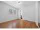 Bright bedroom boasts hardwood floors, two windows, and a neutral color scheme at 2140 S Washington St, Denver, CO 80210