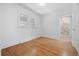 Bedroom offering hardwood floors, double windows, and a connecting bathroom at 2140 S Washington St, Denver, CO 80210