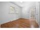 Bedroom with gleaming hardwood floors and neutral walls with an ensuite bathroom at 2140 S Washington St, Denver, CO 80210