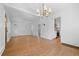 Dining area features hardwood floors, chandelier, and access to the kitchen at 2140 S Washington St, Denver, CO 80210