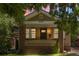 Charming brick home featuring a front porch, well-maintained landscaping, and curb appeal at 2140 S Washington St, Denver, CO 80210