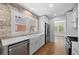 Updated kitchen with stainless steel appliances, white countertops, and farmhouse sink at 2140 S Washington St, Denver, CO 80210