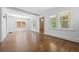 Bright living room with hardwood floors, white walls, and large windows at 2140 S Washington St, Denver, CO 80210