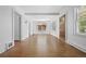 Open-concept living room featuring beautiful hardwood floors and natural light at 2140 S Washington St, Denver, CO 80210