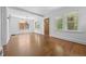 Bright living room with hardwood floors, white trim, and natural light at 2140 S Washington St, Denver, CO 80210