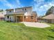 Expansive backyard featuring a large grassy area, patio, and fenced perimeter at 7405 S Jackson Ct, Centennial, CO 80122