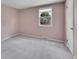 Neutral bedroom featuring plush carpet, a bright window and a closet at 7405 S Jackson Ct, Centennial, CO 80122