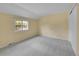 Bright bedroom featuring plush carpet, a bright window and a closet at 7405 S Jackson Ct, Centennial, CO 80122