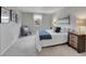 Cozy bedroom with neutral tones, plush carpet, and ample natural light at 7405 S Jackson Ct, Centennial, CO 80122