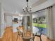 Eat-in kitchen area with a glass table, stainless steel appliances, and sliding glass doors to the backyard at 7405 S Jackson Ct, Centennial, CO 80122