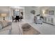 Bright living room and dining area featuring neutral tones, modern furnishings, and an open concept design at 7405 S Jackson Ct, Centennial, CO 80122