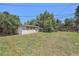 View of a spacious backyard and outbuilding, perfect for storage or hobbies at 1148 Rosemary St, Denver, CO 80220