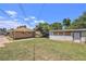 Large backyard with a storage building and plenty of room for outdoor activities at 1148 Rosemary St, Denver, CO 80220