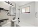 Elegant bathroom with pedestal sink, modern fixtures, and natural light at 1148 Rosemary St, Denver, CO 80220