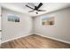 Spacious bedroom with modern ceiling fan and hardwood flooring at 1148 Rosemary St, Denver, CO 80220