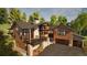 Architectural marvel boasting natural wood siding, stone accents, and an inviting outdoor deck with a cozy fireplace at 2035 Highlands Dr, Breckenridge, CO 80424