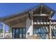 Modern home under construction with wood and stone exterior, showcasing large windows and architectural detail at 2035 Highlands Dr, Breckenridge, CO 80424