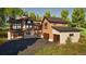 Stunning multi-level home with modern design, complemented by wood and stone accents, and a spacious driveway at 2035 Highlands Dr, Breckenridge, CO 80424