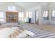 Spacious living room with large windows, fireplace, and stairs leading to the second floor still under construction at 2035 Highlands Dr, Breckenridge, CO 80424