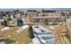 Aerial view of community landscape, including a pond and residential buildings at 3184 S Heather Gardens Way # 406, Aurora, CO 80014