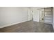 Bright bedroom featuring hardwood floors, barn door, and ensuite bathroom at 3184 S Heather Gardens Way # 406, Aurora, CO 80014