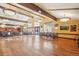 Large community room with hardwood floors at 3184 S Heather Gardens Way # 406, Aurora, CO 80014