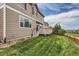 Exterior view of a house featuring a wooden deck, lawn, and fenced backyard at 2856 Penstemon Way, Castle Rock, CO 80109