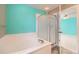 Bright bathroom featuring a tiled shower with a glass enclosure at 2856 Penstemon Way, Castle Rock, CO 80109
