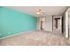Spacious carpeted bedroom with a ceiling fan and access to closets at 2856 Penstemon Way, Castle Rock, CO 80109