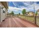 Spacious wooden deck with brown railings offering outdoor living and entertaining space at 2856 Penstemon Way, Castle Rock, CO 80109