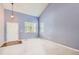 Spacious carpeted living room with a high ceiling and large windows at 2856 Penstemon Way, Castle Rock, CO 80109
